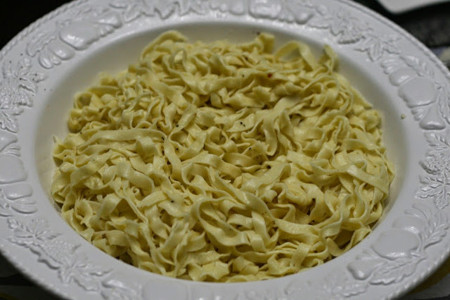 Freshly cooked pasta drizzled with truffle oil, sprinkled with salt and pepper. 