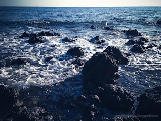 Calm Ocean Waves On Rocky Beach In The Morning Sun At Umeanyar Village North Bali Indonesia