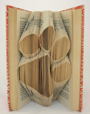 pages folded into the shape of a dog paw
