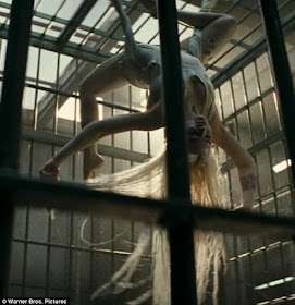 Harley Quinn Swinging In Jail Cell