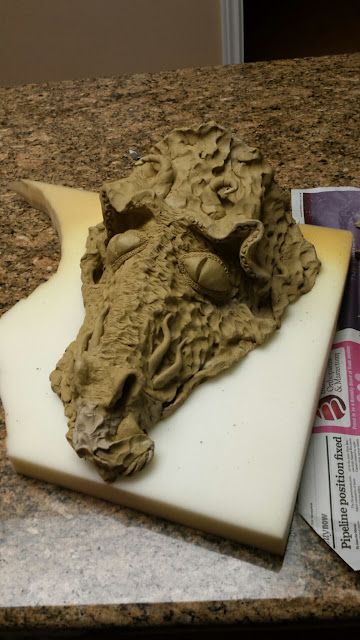 Pottery / stoneware dragon mask by Lily L, in progress.