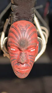 Carved wooden face on the front of a Maori canoe at the Waitangi Treaty Grounds