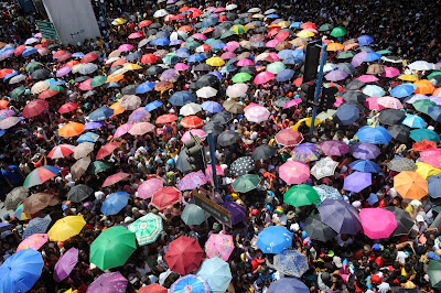 Thousands of people line up for charity packages being given out by the politically-influential Filipino sect, Iglesia ni Cristo (Church of Christ) in Manila on October 14, 2013, as they hold a massive evangelical event in five arias in the city that attracted over a million people and brought Manila to a standstill with gigantic traffic jams. The sect of about three million is dwarfed by the country's huge number of Roman Catholics but is known for the unity and the discipline its followers show to their leaders. Its members vote as a bloc which gives them great political weight. During elections, many Filipino politicians seek the 'anointment' of the leaders of the sect to win the votes of their followers