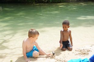 Children playing at Frenchman's Cove Beach, Portland, Jamaica