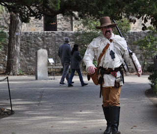 Alamo Defender Man in period American Frontier clothing at the Alamo