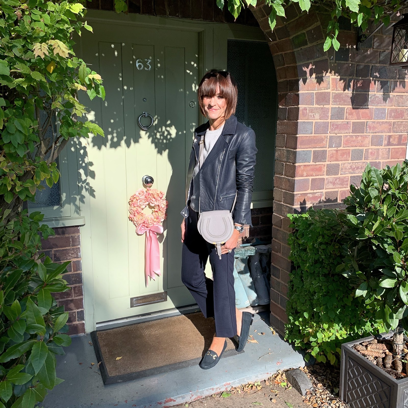 my midlife fashion, massimo dutti leather biker jacket, marks and spencer pure cashmere round neck jumper, chloe marcie small acrossbody bag, j crew cropped kick flare trousers, jones bootmake ella leather flat loafer
