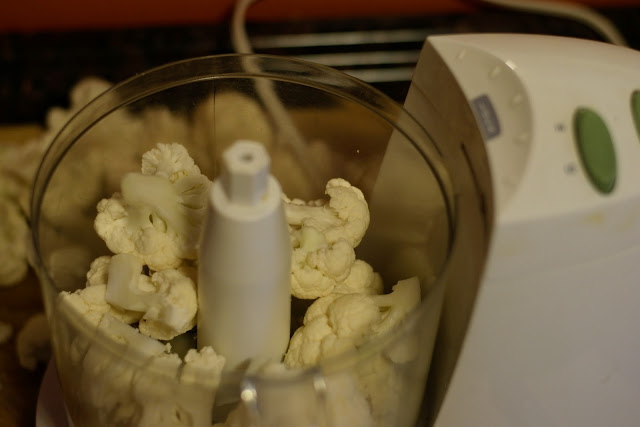 Cauliflower florets in a food processor.  