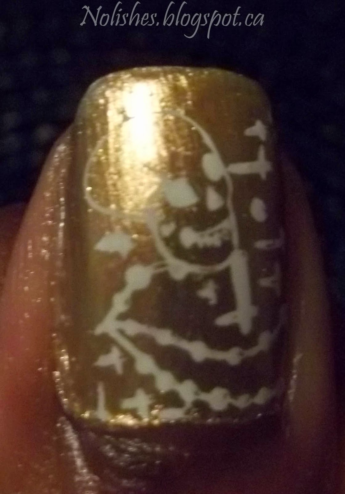Nail stamping manicure with white Gustav Klimt inspired images (from Moyou London Artist 14) stamped over a gold/pink duochrome base. 