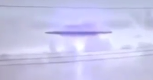 Closer look at the UFO over the boat on the river.