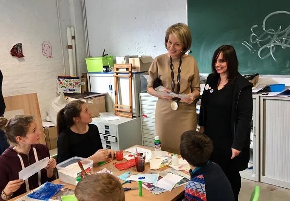 Queen Mathilde visited BPS22 Art Center in Charleroi. Queen mathilde wore Dries Van Noten dress and Delphine Nardin Gold Earrings, carried DFV Elaphe clutch