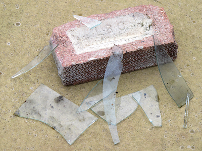 A brick and broken glass