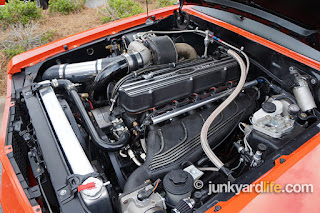 The hand-built intake manifold resembles a BMW factory piece.