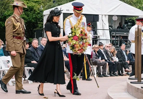 Meghan Markle, wearing an elegant Emilia Wickstead wool crepe dress and Philip Treacy hat. Aquazzura Deneuve pow pointy poe pump