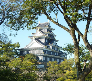 Okayama Castle through trees as seen from the Korakuen Garden, Okayama