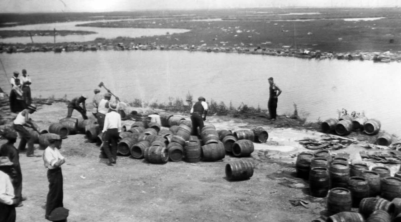 Police dumping beer from barrels into sand at Atlantic City.