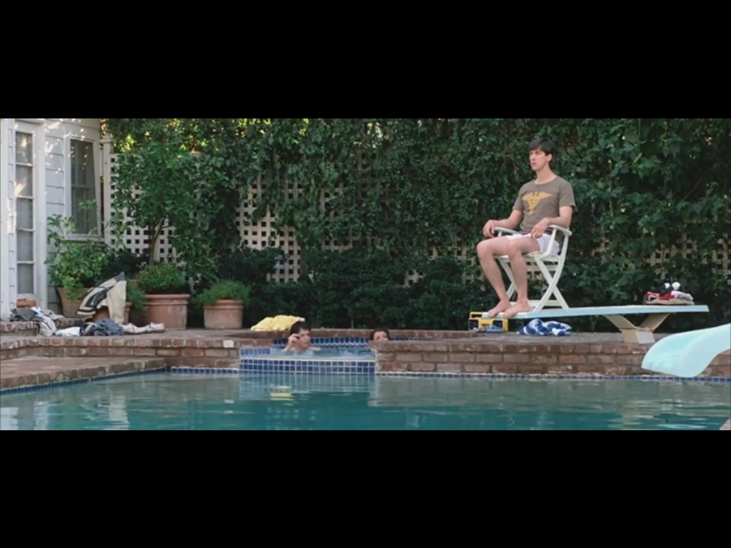 This image shows Cameron sitting on a chair overlooking a pool while Ferris and Sloane ar...