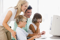 family looking at computer