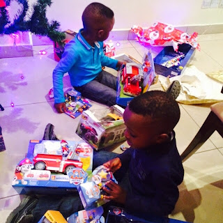 Odukoya children playing with christmas toys