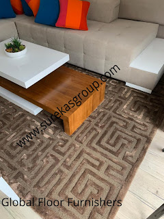 luxurious hand-tufted rug in wool and silk displayed at client living area