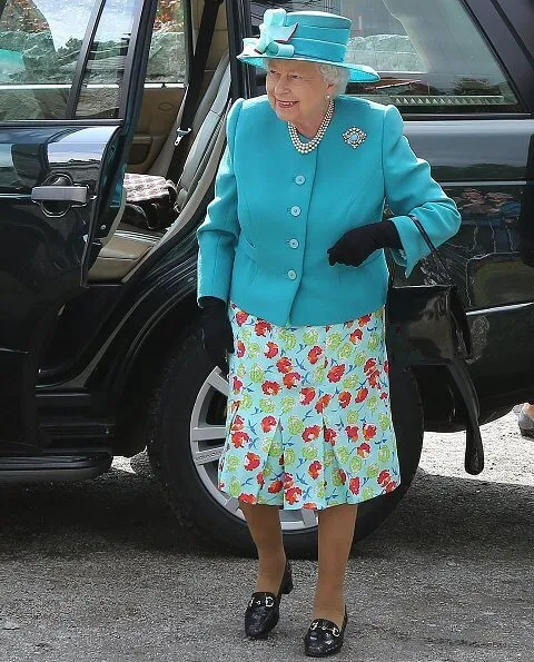 Queen Elizabeth opted for a silver and turquoise broach which she wore on the left side of her fitted blazer at Balmoral