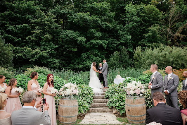 Niagara Wedding Planner - A Divine Affair - Alyssa and Steve - Photo by Gemini Photography. Ceremony outside at the escarpment at Cave Springs Vineyard in Jordan. Reception at Inn on the Twenty with blush and gold decor. Ivory and blush flowers. 