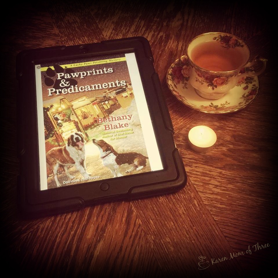 A Cup Of Tea and A Cozy Mystery Pawprints & Predicaments by Bethany Blake