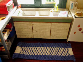 Modern dolls' house miniature kitchen sink unit.