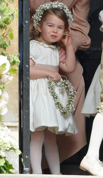 Duchess Catherine, her children Prince George of Cambridge, page boy and Princess Charlotte of Cambridge, flower girl attend the wedding of Pippa Middleton