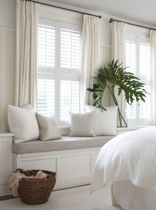 Beautiful bedroom with white plantation shutters