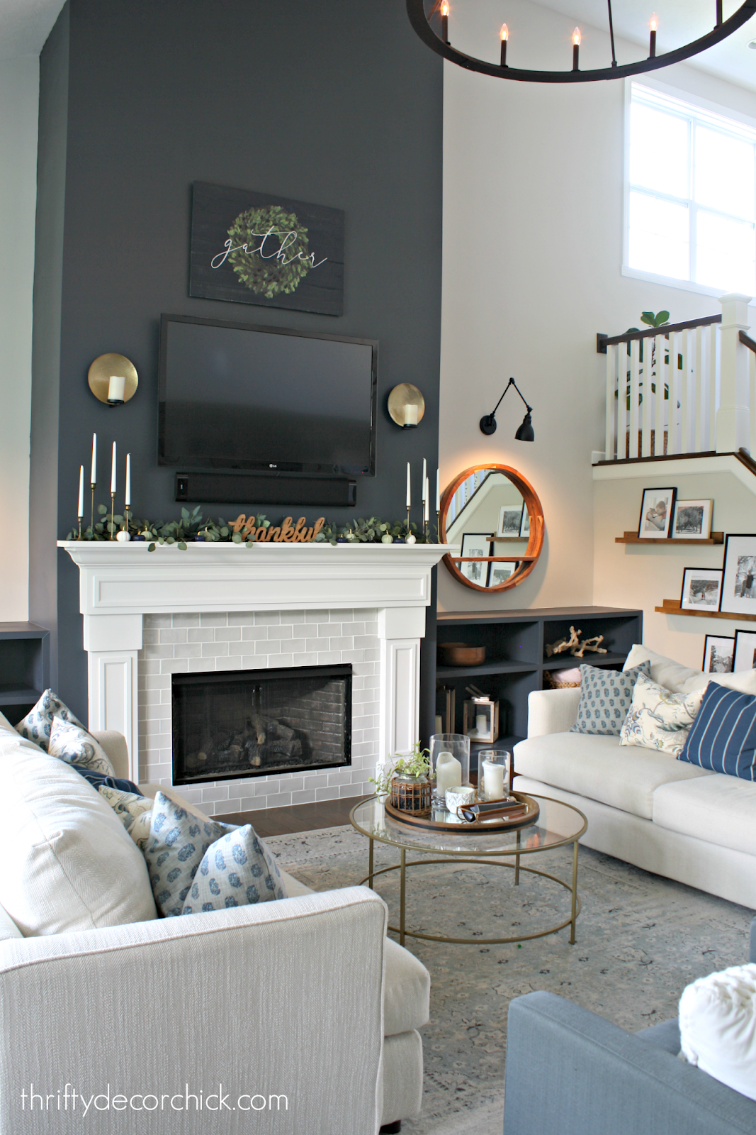 Dark blue fireplace wall with built ins