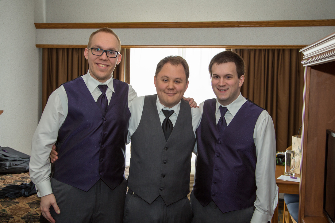 A photo of myself and my two groomsmen dressed up in our tuxedos, sans jackets.