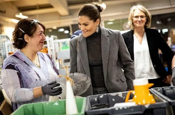 Crown Princess Victoria wore Erdem X H and M wool suit, Kreuger Jewellery summer feather earrings, Valentino shoulder bag. City Mission