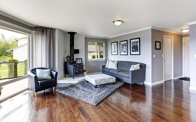 Medium width hardwood floor updates the look of this living space