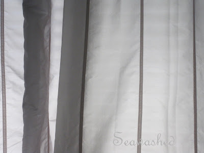 Her pale gray curtains with velvet trimI love these curtains