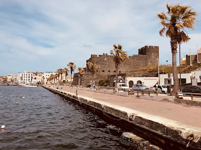 View of the port of Pantelleria with castello Barbacane in the background.