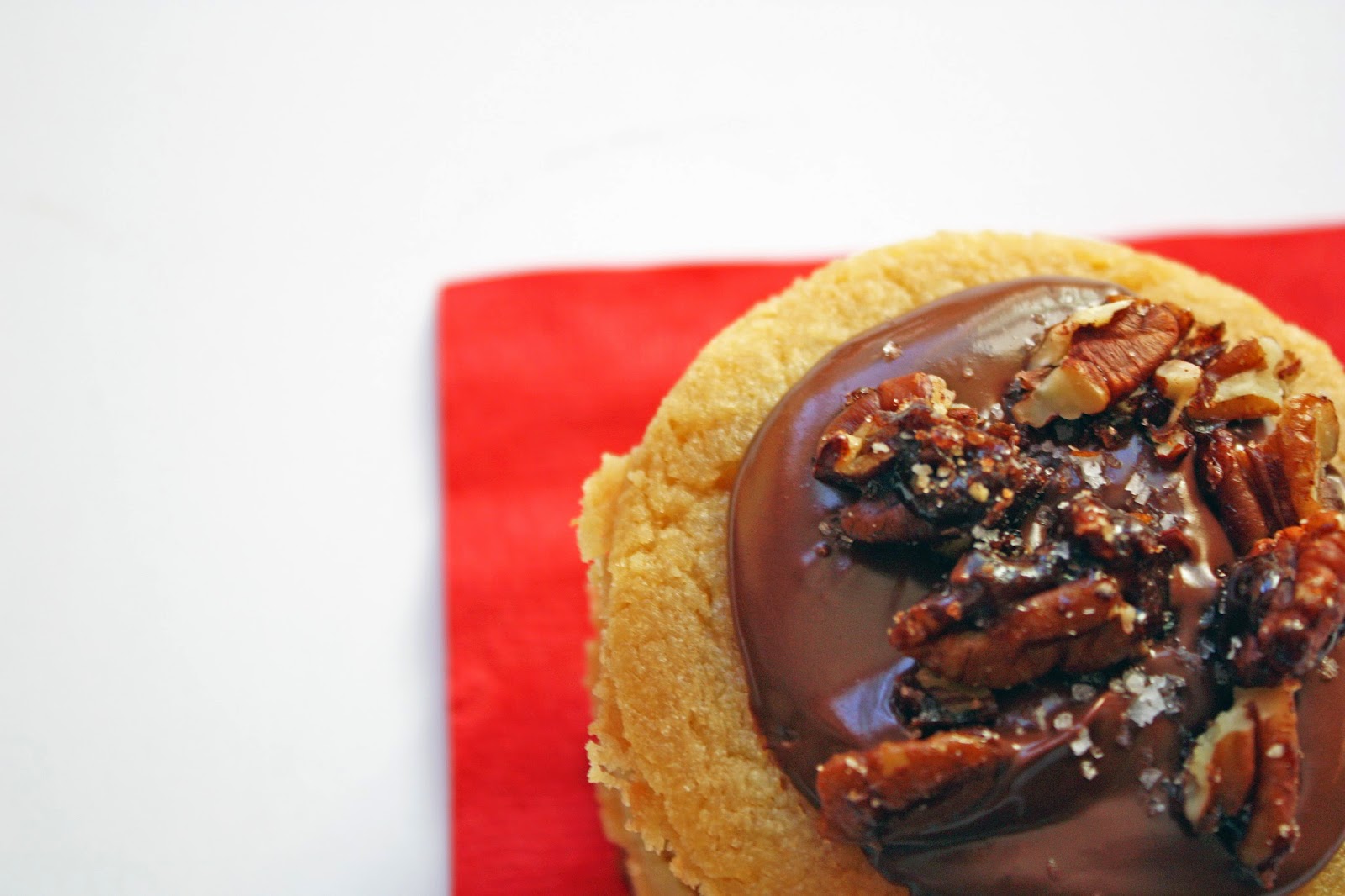 salty sweet toffee cookies with dark chocolate glaze and candied pecans