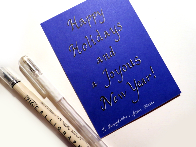 Holiday greeting written with a ZIG Calligraphy marker and highlighted with a white gel pen.