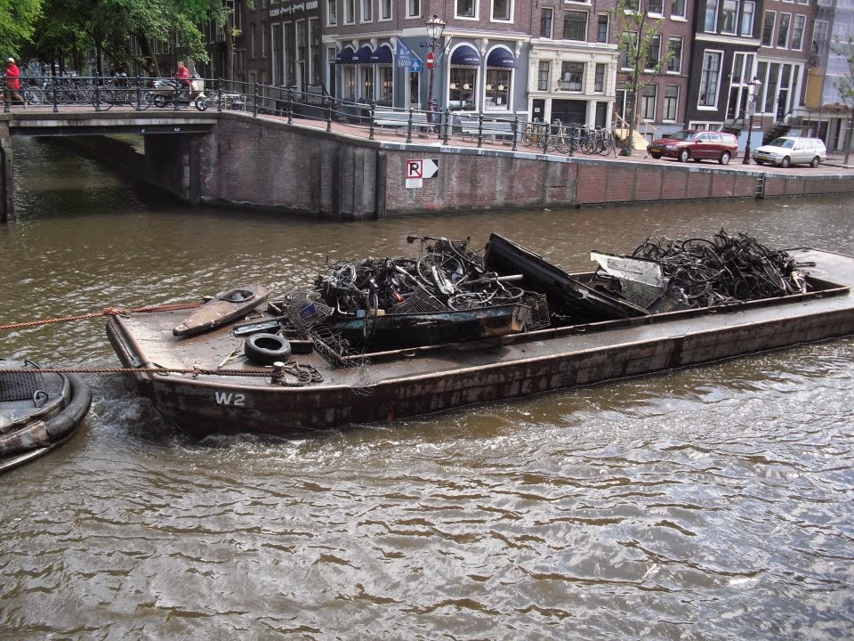 When In Amsterdam... How many cars and bicycles fall into Amsterdam canals?