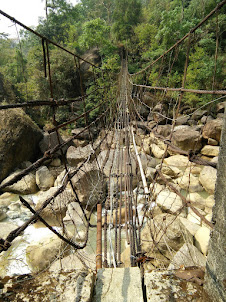 Crossing the scary bridge on way to Living roots bridge.