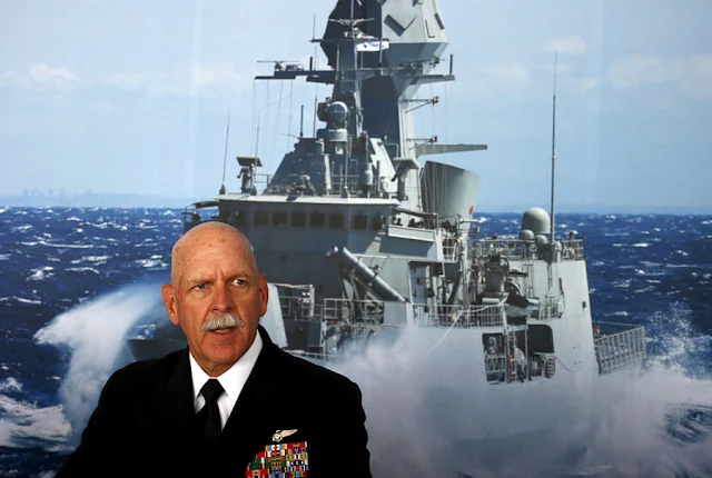 FILE PHOTO: Commander of the U.S. Pacific Fleet Admiral Scott Swift sits in front of a large poster of an Australian Navy frigate as he speaks during a media conference at the 2015 Pacific International Maritime Exposition in Sydney, Australia, October 6, 2015. REUTERS/David Gray/File Photo