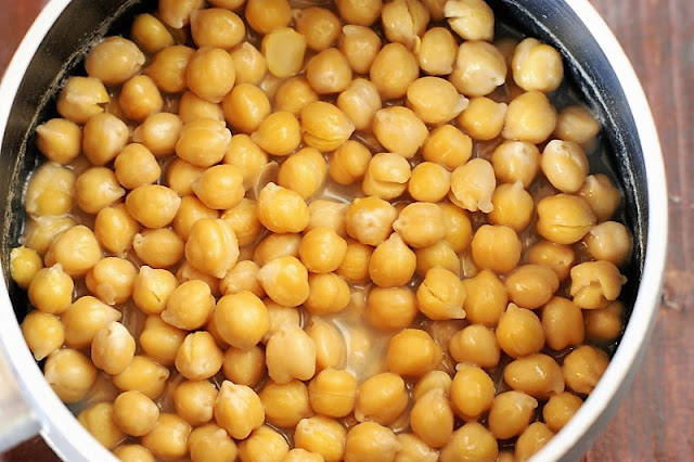 Chickpeas Simmering in Saucepan to Soften Them Image