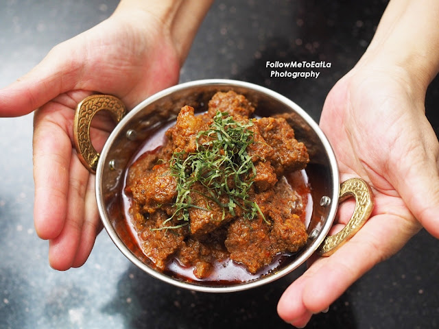 12. Sprinkle with finely sliced turmeric leaves over the Beef  Rendang when serving.