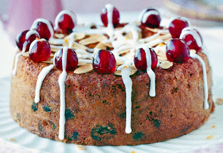 Cherry and Almond Cake: A sponge cake containing grated marzipan and fruit in the batter served topped with cherries and white icing. A great alternative Christmas or Easter Cake