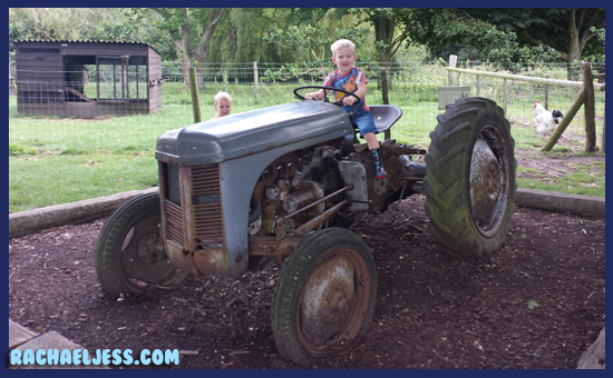 Playing on the tractor at Middle Farm