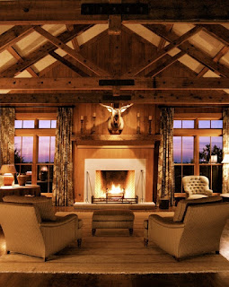 Stony Rustic Fireplace Mantels to Decorate Your Rustic Living Room Unusual Ornament in the Sitting Space with Rustic Fireplace Mantels and Brown Sofas under the Wooden Ceiling