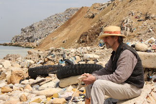 Jeremy Irons by a mountain of rubbish in Lebanon (in 'Trashed')