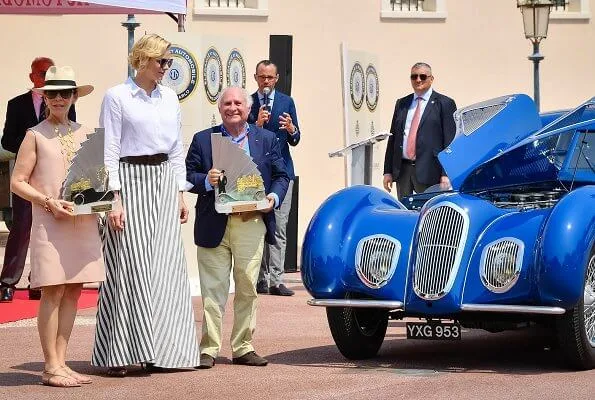 Princess Charlene wore Akris Punto striped flared skirt and white shirt. Prince's Palace of Monaco classical car event