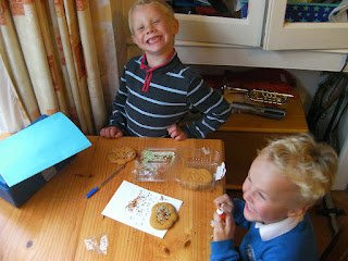 laughing schoolchildren doing home made cakes