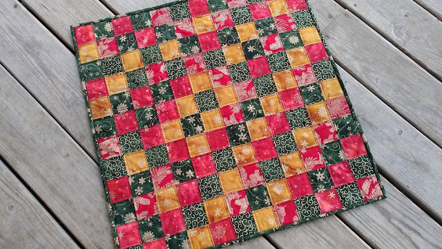Metallic batiks quilted table topper