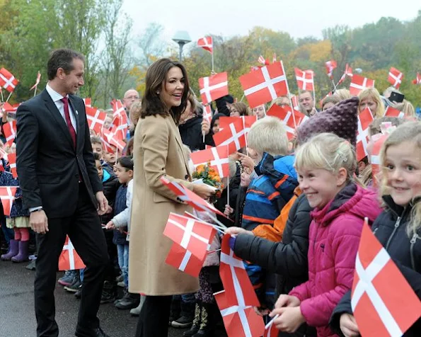 Crown Princess Mary wore Prada dress, Gianvito Rossi dress, coat, Gold diamond earrings, Prada trousers, new winter trend dress